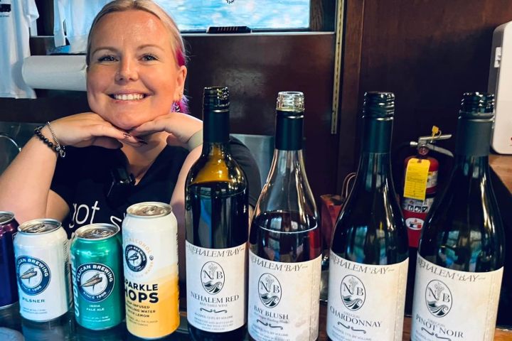 a person holding a bottle of wine