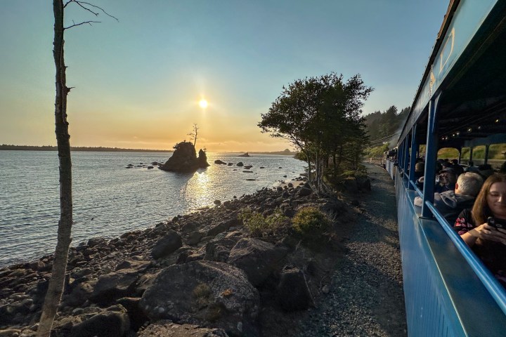 a group of people on a bridge over a body of water