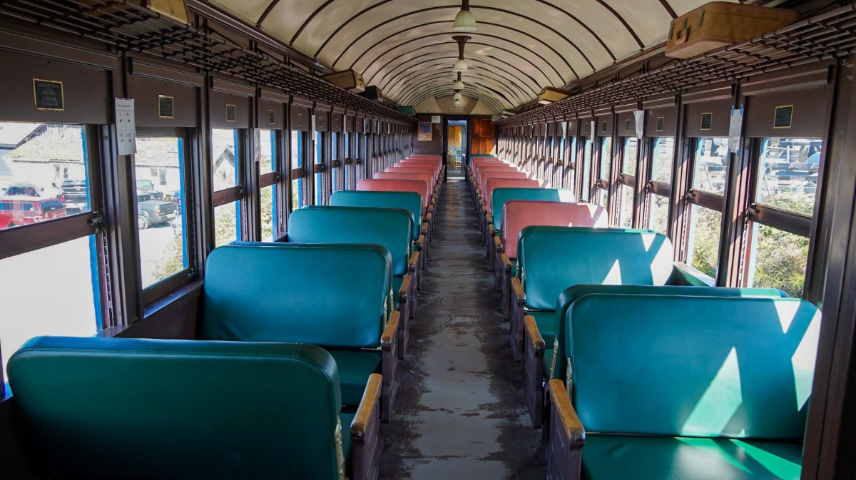 a room filled with furniture and a large window